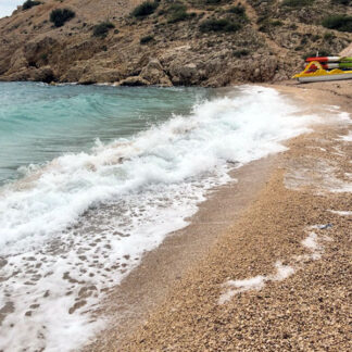 Ocean, heavy waves and wind, little stones at beach, Skrila, Croatia