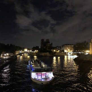 Seine river, bridge, boats passing, traffic on wet road, Paris, France
