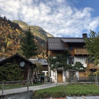 Village, Alps, Hallstatt, quiet, some wood working, small saw, people walking by on gravel, talking, Hallstatt, Austria